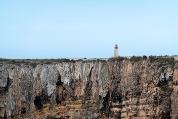 Lighthouse on edge Ponte de Sagres peninsula in Portugal