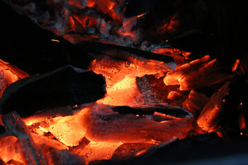 glowing coal in a barbecue in brazil. close up
