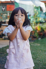 Fototapeta premium Happy cute child having fun in the garden.