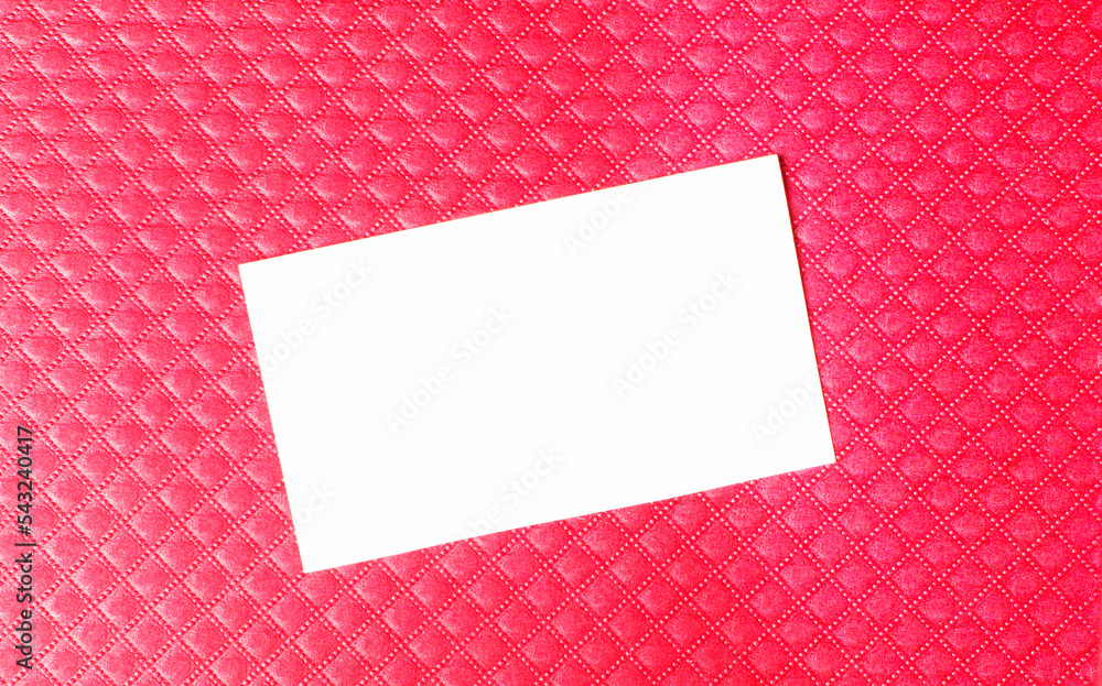 Poster white blank business card with space to insert text on a red background. copy space