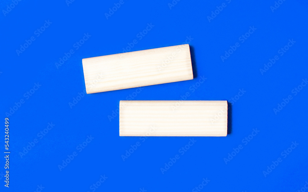 Poster two wooden blocks with space to insert text on a blue background. copy space