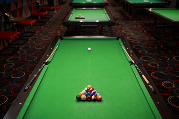 Billiard table with green surface and ball