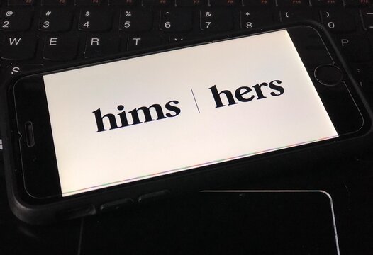 Spokane, WA/USA - October 2021: Hims logo on a smartphone. Hims, Inc. is a telemedicine company that operates Hims and Hers, which sell men's and women's personal care products.