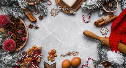 Happy New Year 2023. Banner with kitchen utensils, Christmas decorations, cinnamon, gingerbread and spruce on a marble background. A greeting card for Christmas. The concept of cafes and restaurants.