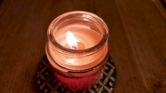 Small candle buring in slow motion