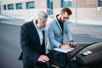 business people working outside office building