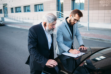 business people working outside office building