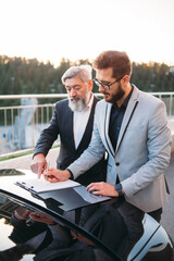business people working outside office building