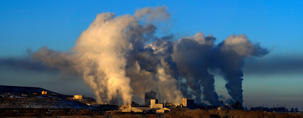 Factory Energy Plant Producing Pollution Smoke Into the Air Blue Sky and Moon