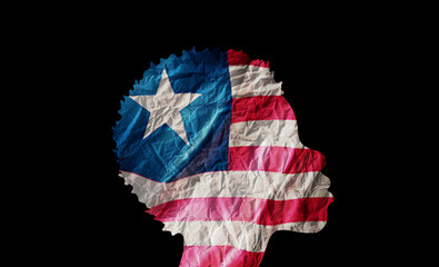 African woman silhouette with Liberia national flag.