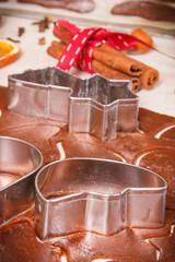 Dough and cookie cutters for baking cookies or gingerbread, festive Christmas time concept