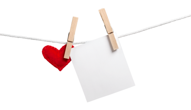 Red decorative heart and white card on rope on  white background