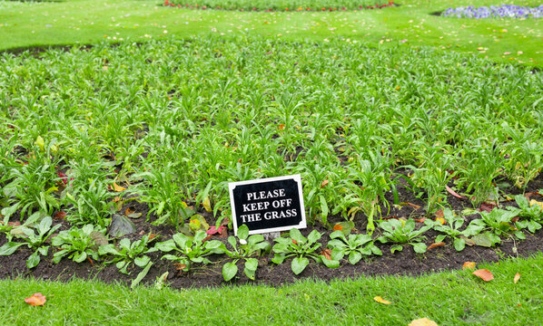 Please Keep Off The Grass Sign In A Community Garden