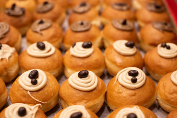 Fototapeta premium Decorative donuts in a Jerusalem bakery during the celebration of the Jewish holiday of Hanukkah, when it is traditional to eat foods fried in oil.