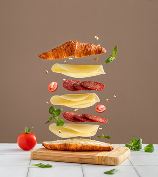 sandwich with cheese and salami. Creative minimal concept.