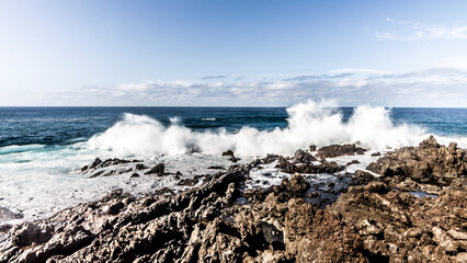 waves crashing on rocks