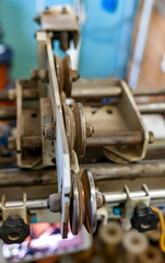 Fototapeta premium Elements of the winding machine in close-up in the mechanical assembly shop of the enterprise