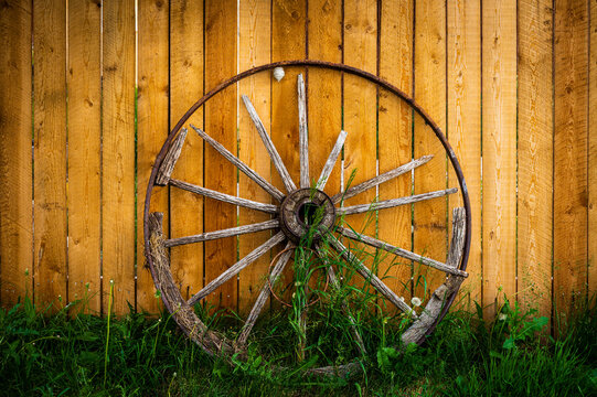 wagon wheel on fence
