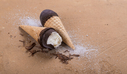 Creamy ice cream in chocolate glaze and waffle cup