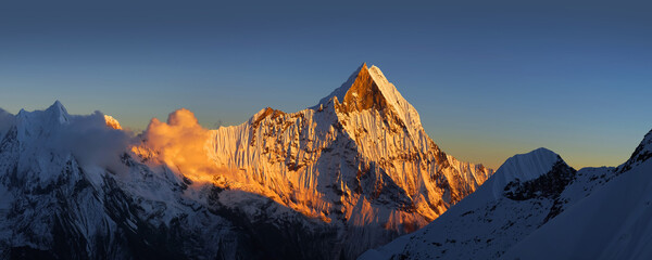 Sacred mount Machapuchare at sunset. Himalaya mountains, Nepal.