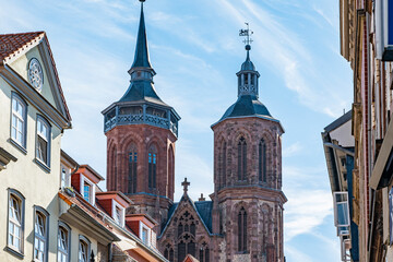 Facades of the old town of Goettingen with view of the church towers of St. Johannis Church,...
