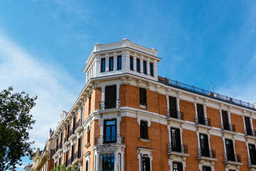 Fototapeta na wymiar Old luxury residential building with brick facade in Chamberi district in central Madrid