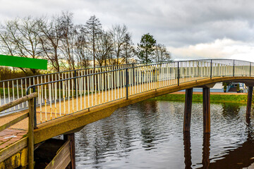 Bridge made of wood metal over river in nature Germany.