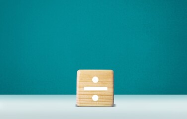 Division image on a wooden block stand on the desk