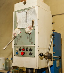 The upper part of the drilling machine is a close-up in the mechanical assembly shop of the...