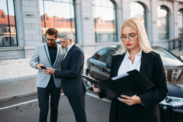 Portrait of a business woman with colleagues on background