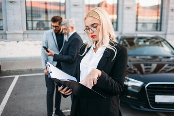 Portrait of a business woman with colleagues on background