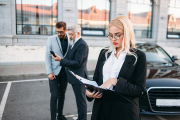 Portrait of a business woman with colleagues on background