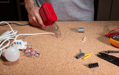 soldering iron - connecting wires with tin and a soldering iron, workshop, electrical elements and...