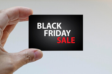 Hand holding a Black Friday ticket