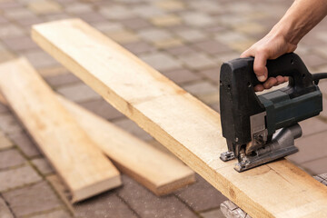 Cutting Boards with Electric Jigsaw. Electrical Tool Equipment for Woodwork. 