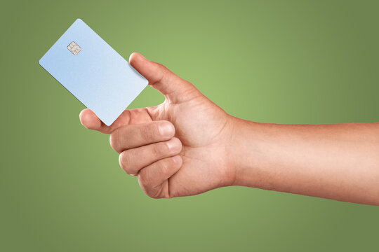 Man's hand holding credit card.