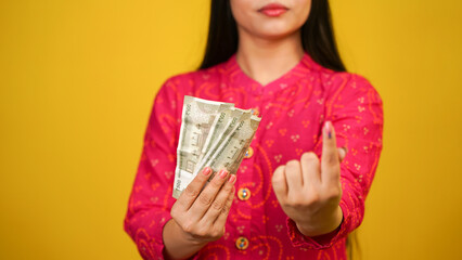 Unrecognizable Woman holding money after casting the vote, Greed, bribery or political corruption...