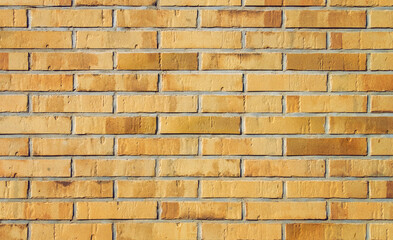 Brick wall background of tan tint. 
Sand color. Closeup.