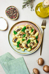 Gnocchi in a creamy sauce with mushrooms and spinach. Healthy eating. Vegetarian food.
