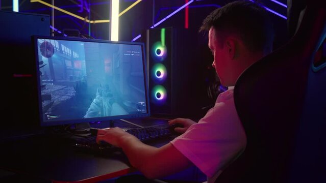 Professional Gamer Wins Internet Multiplayer Tournament Match In FPS Game. Professional Gamer Shoots Enemy Team And Disarms Bomb In FPS Game. Young Professional Gamer. FPS Gaming. Shooter. PC