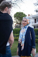 portrait of hijab woman talking to her friend