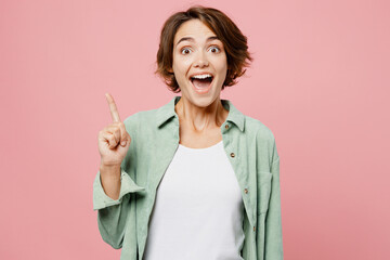 Young insighted smart proactive woman wear mint shirt white t-shirt holding index finger up with...