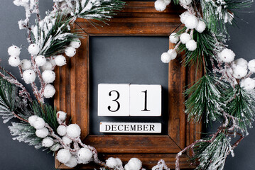 Christmas decorations and wooden frame. Fir branch on a gray background. copy space
