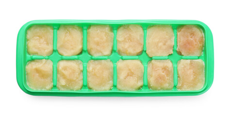 Puree in ice cube tray on white background, top view. Ready for freezing