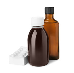 Bottles of syrups with pills on white background. Cough and cold medicine