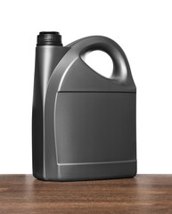 Motor oil in grey container on wooden table against white background