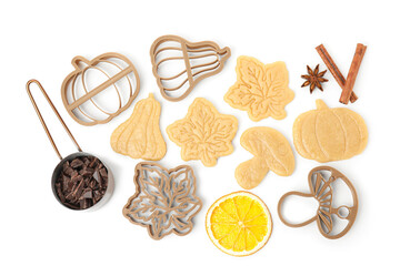 Fototapeta na wymiar Flat lay composition with cookie cutters and unbaked biscuits on white background