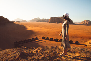 Slim beautiful caucasian woman tourist stand on cliff barefoot watch sunrise and enjoy holiday...