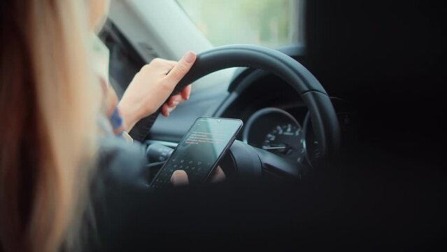 Checking Email Chats And Reading News. Female Writing Message In Vehicle On Social Network Chats On Cellphone. Texting And Driving Car On Social Media. Woman Texting On Smartphone While Driving Car.