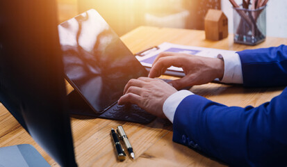 Business team present. professional investor working new start up project. Finance managers meeting.Digital tablet docking screen computer design smart phone using, in morning light